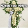 White floral standing spray shaped like a cross with a ribbon