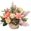 Basket arrangement with pink lilies, cream roses, and lavender flowers