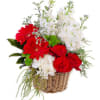 Red roses and white flowers arranged in a wicker basket