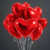 Cluster of red heart-shaped balloons with curling ribbons