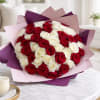 Bouquet of red and white roses wrapped in pink and purple paper