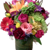 An arrangement with mixed flowers an filled  with many colors to