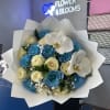 Bouquet of blue and cream roses with white orchids