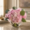 Pink hydrangea bouquet in a clear glass vase