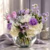 Lavender and white bouquet in a clear glass vase