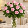 Pink roses arranged in a clear glass vase
