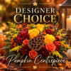 Autumn floral centerpiece in a pumpkin with roses and mums