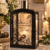 Black lantern candle with memorial text and bird design