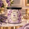 Lavender scented candle in a black-lidded jar with purple floral print