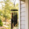Hanging black wind chime with sunflower-printed tubes