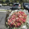 Large bouquet of pink and peach roses with white filler flowers