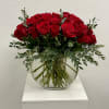 Bouquet of red roses in a round glass vase