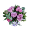 Bouquet of lavender roses with white filler flowers and greenery