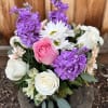 Bouquet of pink and white roses with purple blooms and white daisies