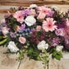 Large pastel bouquet with pink gerberas, roses, and purple flowers