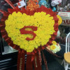 Heart-shaped yellow rose wreath with a red ribbon border and large red number 5