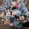 Pastel bouquet of roses, hydrangeas, and lavender flowers