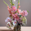 Pink and white floral arrangement in a metallic vase