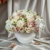Blush and white rose bouquet in a white vase