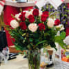Bouquet of red and white roses in a clear glass vase