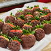 Tray of chocolate-covered strawberries with sprinkles