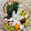 Fruit basket with flowers in a wicker handle basket