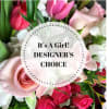 Mixed pink and white flowers with a circular "It's A Girl!" label