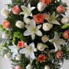Standing floral spray with white lilies and peach roses