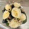 Bouquet of cream roses with black ribbon and decorative beaded accents
