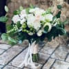 White and blush bouquet with roses and hydrangea, tied with ribbon