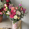 A lively mix of pinks and soft whites makes this flower arrangement