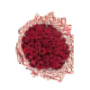 Bouquet of red roses wrapped in patterned paper