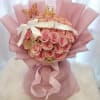 Pink rose bouquet with a crown and butterfly decorations