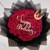 Red rose bouquet with a gold "Happy Birthday" topper and crown