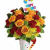 Birthday bouquet of yellow roses, red carnations, and chrysanthemums with a party topper