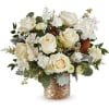 Cream roses and white alstroemeria in a woven basket vase