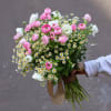 Pink and white bouquet with small daisy-like flowers