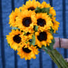 Bouquet of bright yellow sunflowers with dark centers