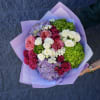 Bouquet of pink, white, and purple roses with hydrangea in lavender wrap