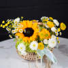 Basket arrangement with a sunflower and white daisy-like flowers