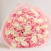 A lush dome of tightly clustered roses in pink, cream, and peach