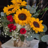 Sunflower and red rose arrangement in a birch-style container
