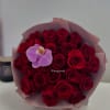 Bouquet of red roses with a single lavender orchid in pink wrap