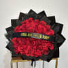 A stunning bouquet of 40 premium red roses, wrapped in sleek black