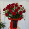 Bouquet of red roses with baby's breath in red wrap