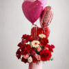 Velvety red and blush pink roses pair with gerbera daisies to create