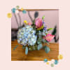 Loose, airy and full of movement-- this bouquet mimics flowers freshly gathered