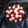 Bouquet of red and white roses wrapped in black paper