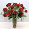Bouquet of red roses in a tall clear glass vase