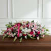 Express your deepest condolences with our Loving Family Casket Spray, a breathtaking